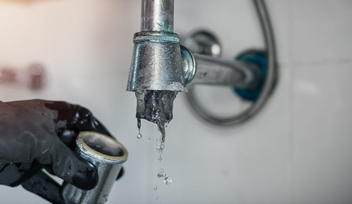 Water dripping from a clogged drain pipe