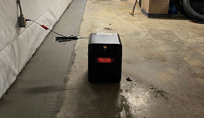 Space heater for waterproofing service in basement floor