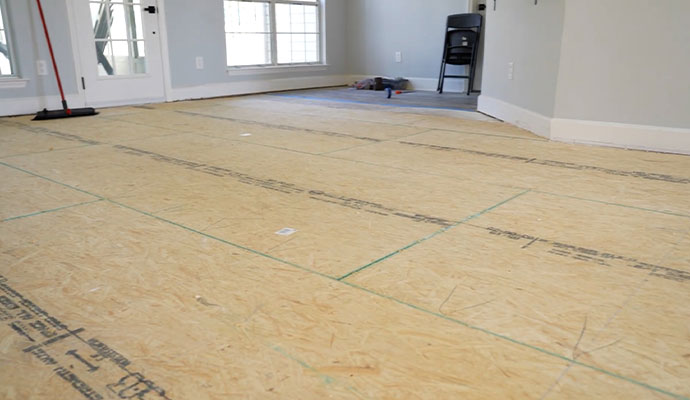 Subfloor installation in progress with oriented strand board panels
