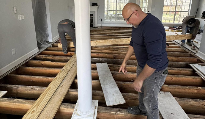 Installing wooden flooring over exposed joists