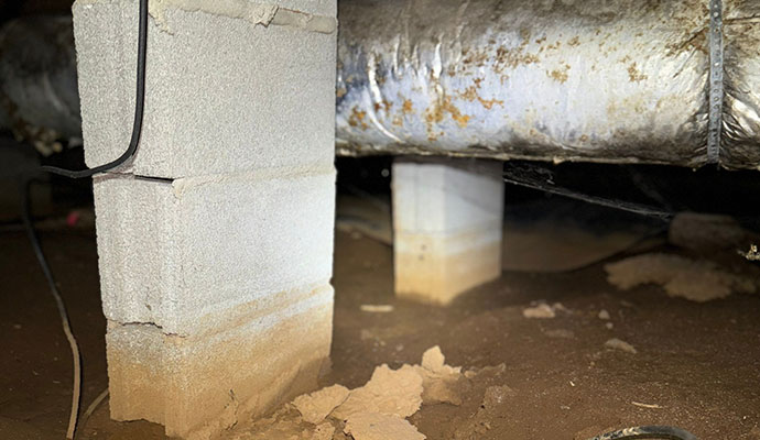 Clear signs of moisture wicking/water damage on a concrete block