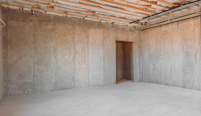 Unfinished concrete basement walls renovation